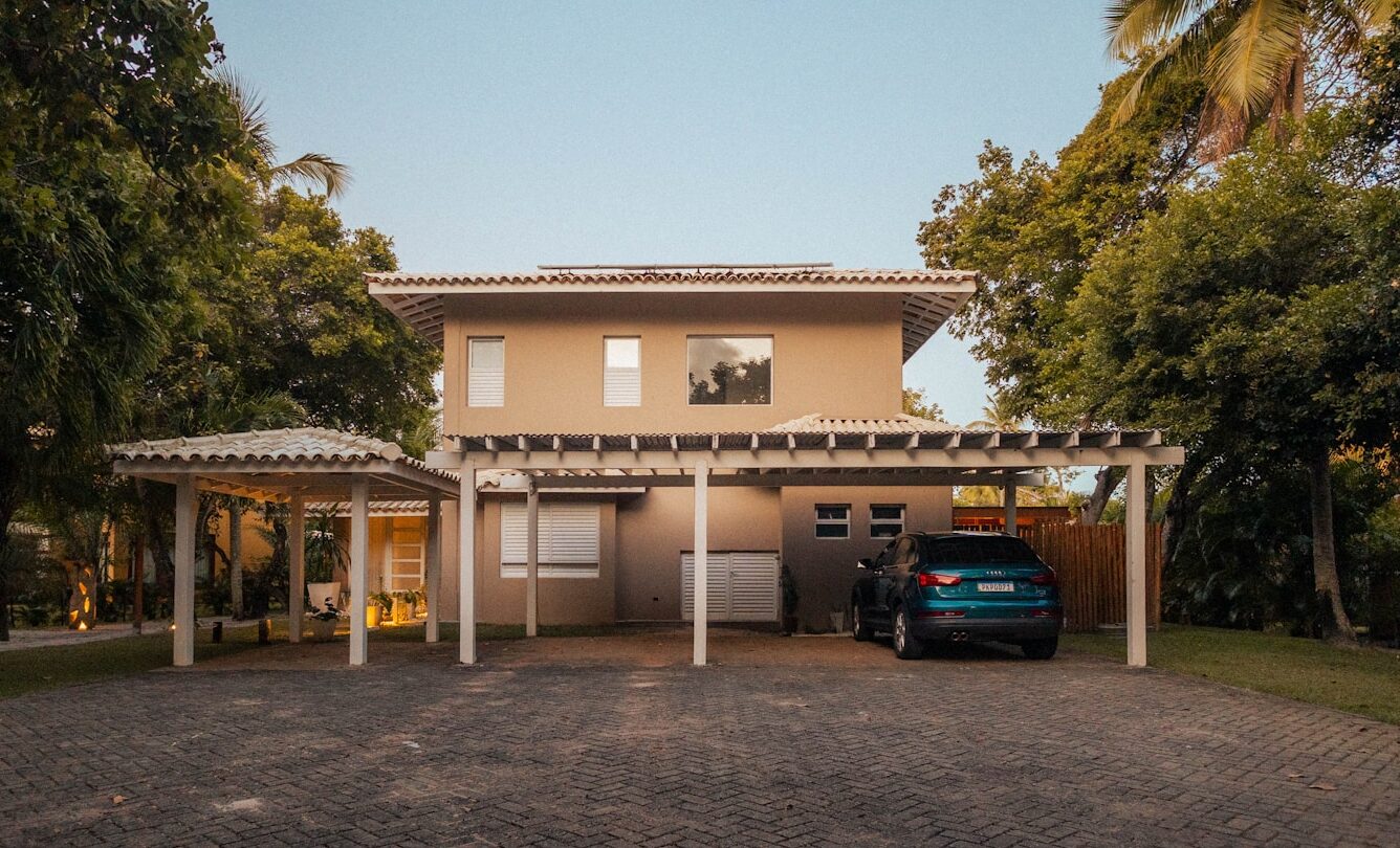 Modern house with carport and car parked outside.